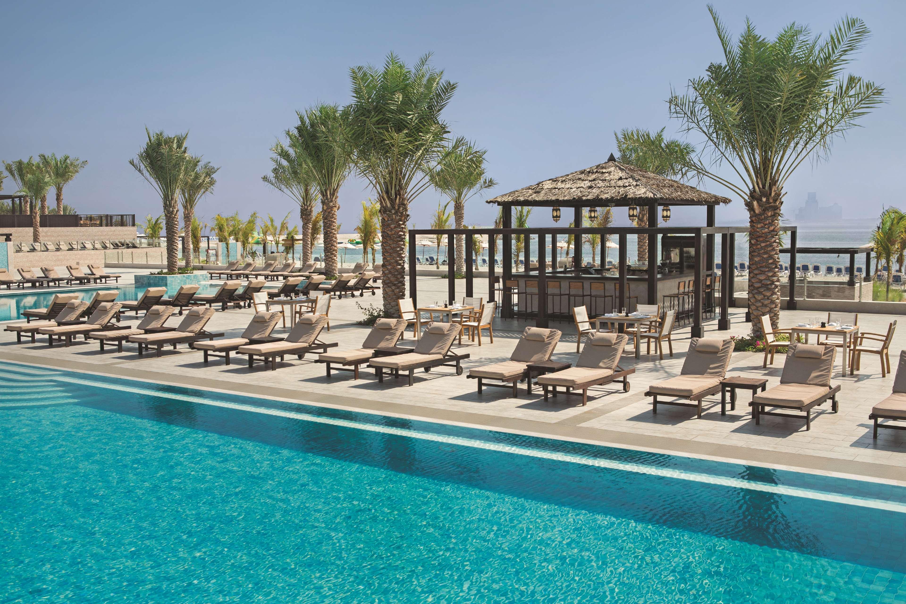 Doubletree By Hilton Resort & Spa Marjan Island Рас ал Хайм Екстериор снимка The pool at the resort