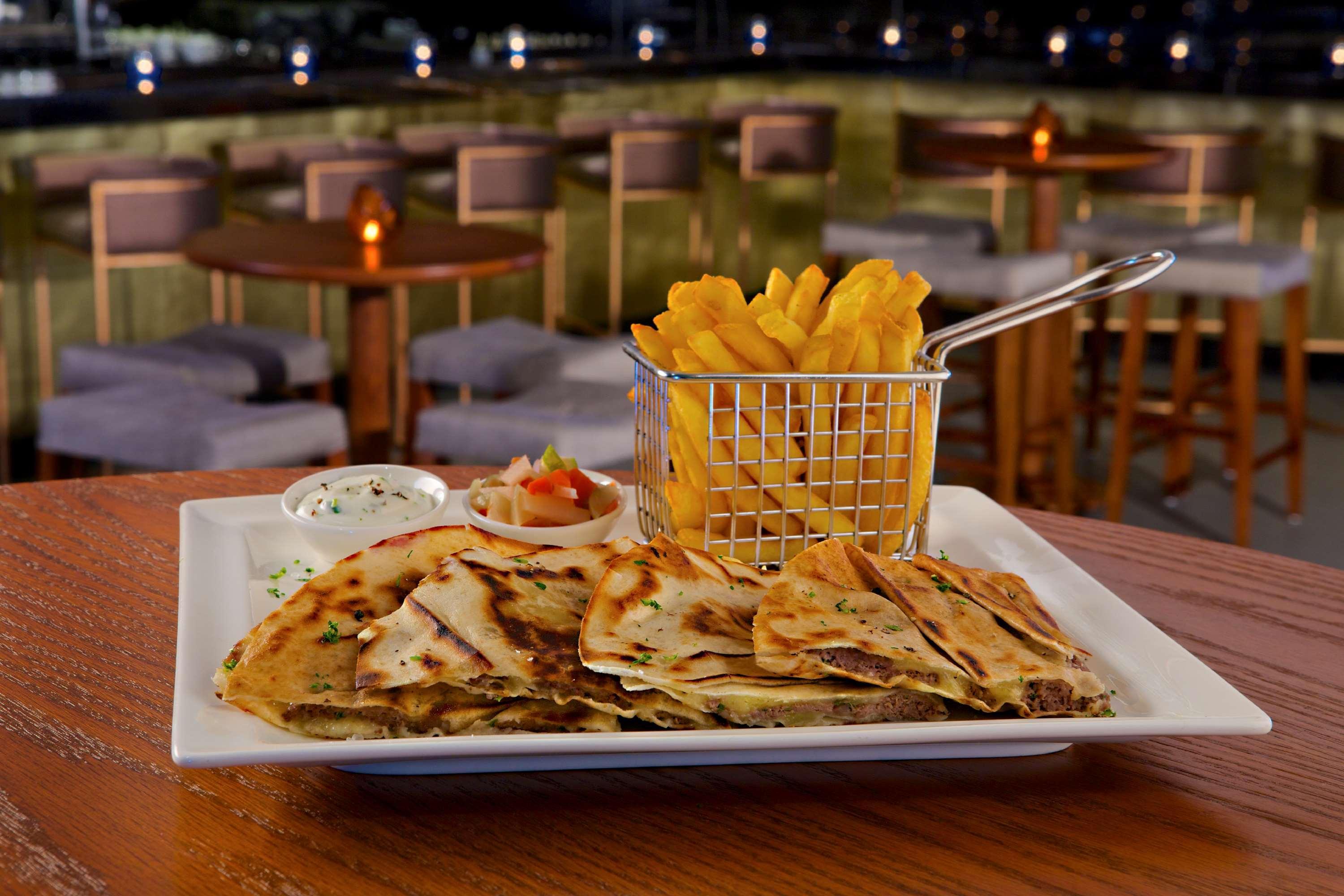 Doubletree By Hilton Resort & Spa Marjan Island Рас ал Хайм Екстериор снимка A plate of quesadillas